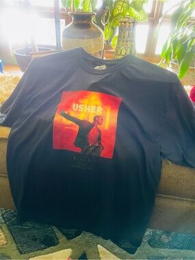 Usher Black Tee with Red-Orange Stage Graphic